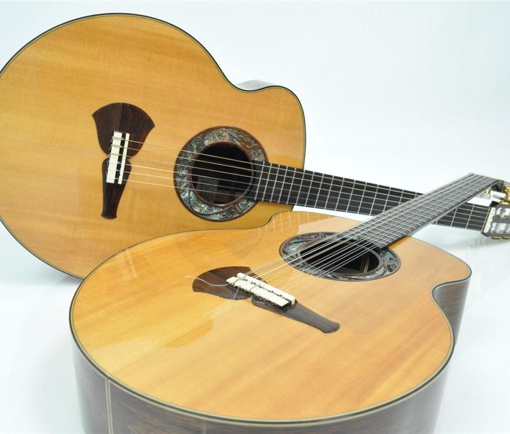 Two electric and steel string acoustic and brown guitars