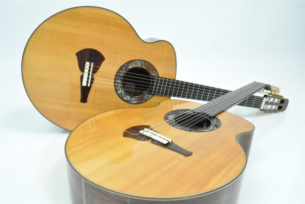 Two electric and steel string acoustic and brown guitars