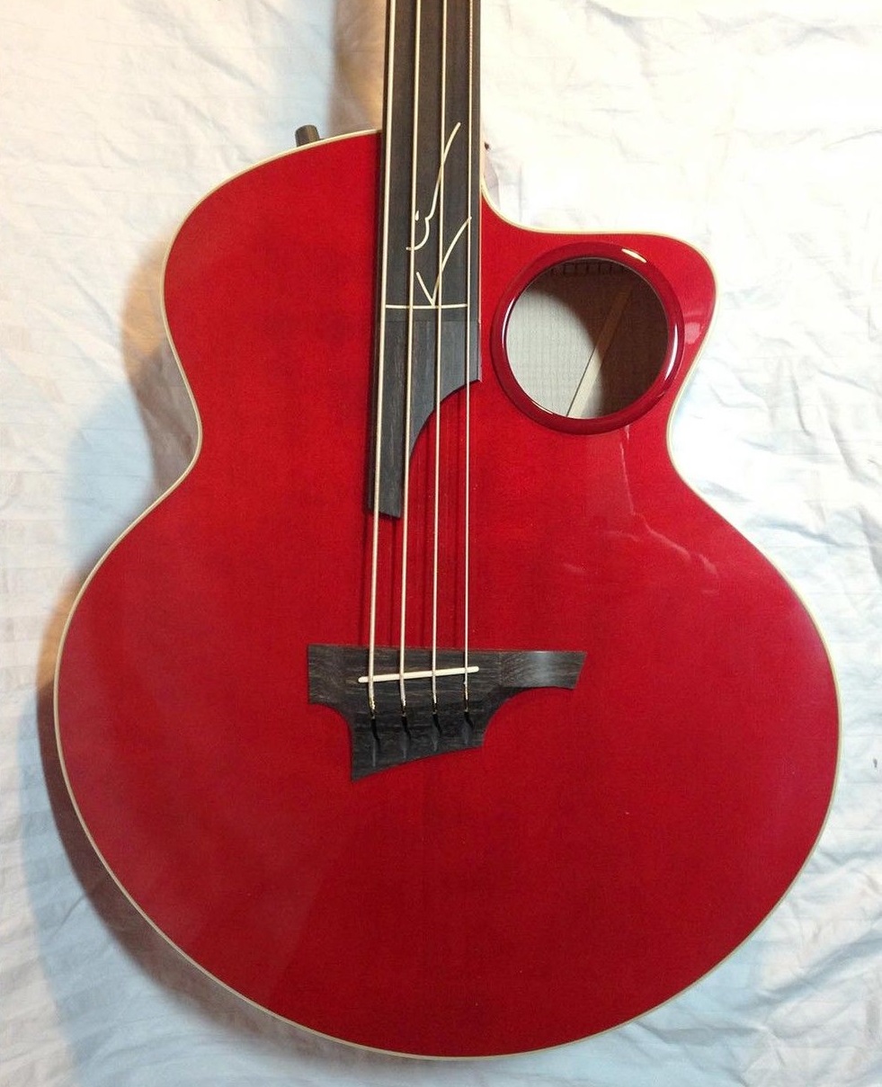A red electric and steel string acoustic guitar
