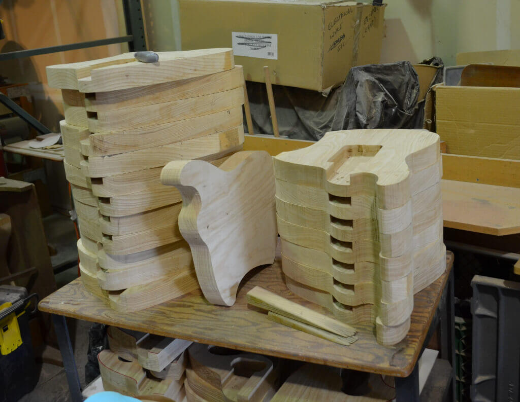 A picture of guitars in the making at the workshop