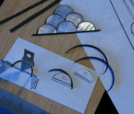 Craft materials and shapes on a table.