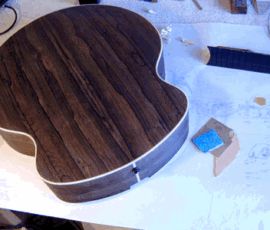 Guitar body on a workshop table.
