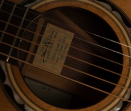 Acoustic rosette and interior label beneath strings