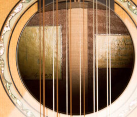 Guitar soundhole revealing handwritten interior label