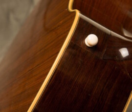 Close-up of a guitar's wooden back.