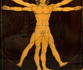 Illustration of Vitruvian Man on wooden surface.