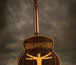 Guitar with Vitruvian Man design on back.