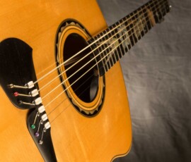 Close-up of guitar soundhole and bridge