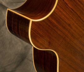 Curved guitar body edges with cream binding