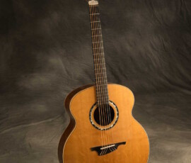 Full-length acoustic guitar on wrinkled backdrop