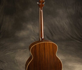 Rear of glossy cutaway acoustic guitar