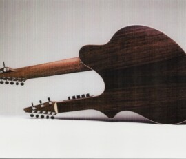 Double-neck guitar lying on white surface.